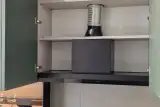 Cappa aspirante a scomparsa integrata nel pensile sopra il piano cottura della cucina AR-DUE